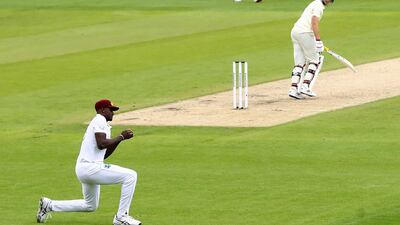 West Indies' captain Jason Holder, left, takes the catch to dismiss England counterpart Joe Root for 23. AP