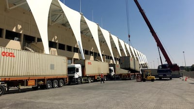 Team lorries loaded with spare parts and tools arrive at Yas Marina Circuit, while other vehicles bring in tyres and race fuel. Courtesy Seven Media