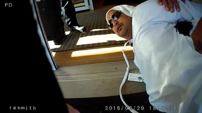 A screen grab from an Avon policeman’s body camera shows Mr Al Menhali pinned down by police outside the Fairfield Inn and Suites in Ohio.Courtesy WEWS NewsChannel5