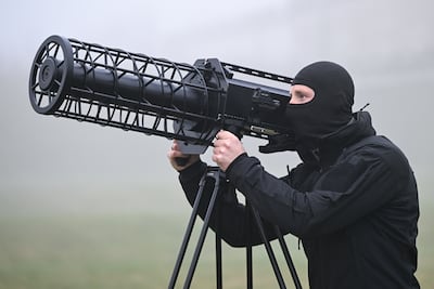 A German police officer aims an electronic frequency jammer used for drone defence. Getty