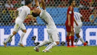 Chile's Gonzalo Jara celebrates during his team's win over Spain on Wednesday at the 2014 World Cup. Pilar Olivares / Reuters