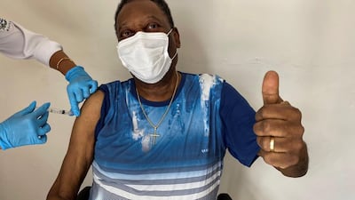 A handout photo made of Pele posing after receiving the vaccine against Covid-19, in Sao Paulo, Brazil. EPA