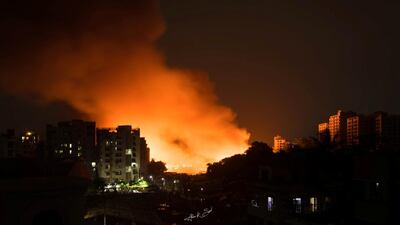 Flames engulf a slum after a fire broke out. Reuters