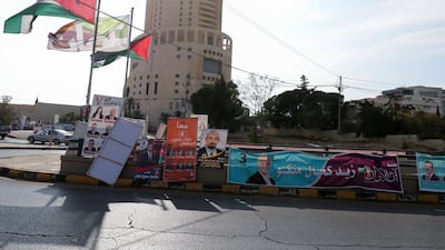 Campaign banners and slogans of candidates for the upcoming Jordanian parliamentary elections line a street in the capital Amman. AFP