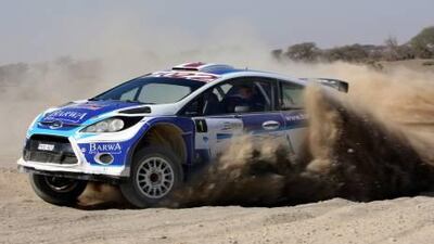 Nasser Saleh al Attiyah speeds through the sand yesterday.