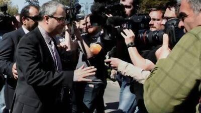Governor of the Central Bank of Cyprus, Panicos Demetriades, leaves the presidential palace after a meeting with Cyprus's president, Nicos Anastasiades, and party leaders in Nicosia.
