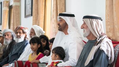 Sheikh Mohamed bin Zayed visits the house of Matar Khalfan Al Neyadi. Seen with Hamad Rashid Mohamed Al Neyadi, right. Mohamed Al Hammadi / Ministry of Presidential Affairs