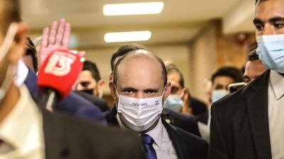 Mr Bennett arrives at the Knesset earlier in the day. AFP
