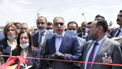 Prime Minister Mustafa Al Kadhimi speaks during the reopening ceremony of a bridge which connects East and West Mosul, northern Iraq, 10 June 2020. EPA