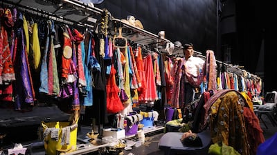 Sayed Faisal, wardrobe manager, The Merchants of Bollywood, inspects the costumes used during the performances.