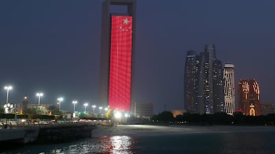 The Chinese flag was projected onto the Adnoc headquarters in honour of Abu Dhabi Crown Prince Sheikh Mohamed bin Zayed's visit to Beijing. Chris Whiteoak / The National