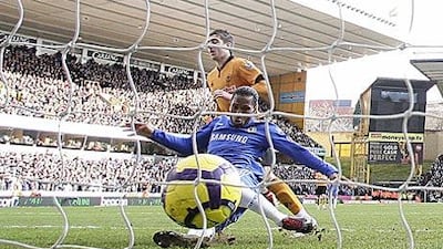 Didier Drogba pokes home Chelsea's opener.