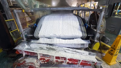Technical grade lithium carbonate comes off a conveyor belt at the Silver Peak lithium mine in Nevada. AP