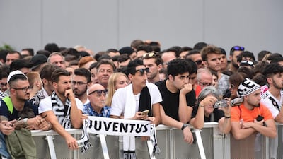 Juventus supporters wait for Ronaldo at the Juventus medical center. AFP