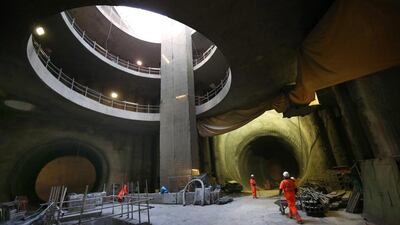 A worker shifts dirt through the eastern ticket hall near Hannover Square. Peter Macdiarmid / Getty Images