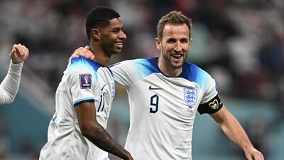 England's Marcus Rashford, left, celebrates with Harry Kane after scoring his team's fifth goal during the 2022 World Cup match against Iran at the Khalifa International Stadium. AFP