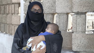 Soniya Sameera with her son Armaan. She needed Dh40,000 to pay off her rent and loan installment. Victor Besa / The National