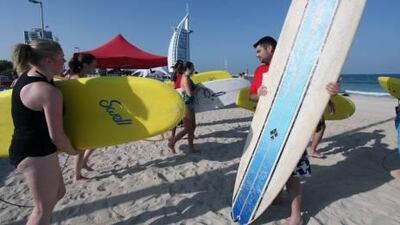 Nathan Lopez, right, from France, prepares to take part in Charity Paddle Around the Burj to raise money for the Mentawi Tsunami Appeal, in Dubai yesterday.