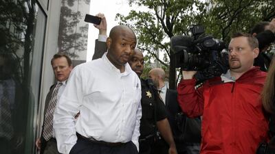 FILE - In this June 11, 2014 file photo, Kevin Roper leaves a court appearance in New Brunswick, N.J. Roper, the truck driver who slammed into a limo carrying actor Tracy Morgan, killing one man and severely injuring the comedian, will ask a judge next week to throw out criminal charges against him. Within days of the accident, Roper was charged in state court with one count of death by auto and four counts of assault by auto, though as of Friday, Dec. 18, 2015, he hadn't been indicted, said his attorney, David Glassman. (AP Photo/Mel Evans, File)