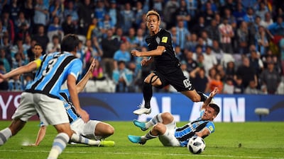 Pachuca midfielder Keisuke Honda, centre, in action against Gremio during the Fifa Club World Cup semi-final. Martin Dokoupil / EPA