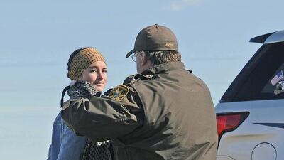 Tom Stromme / The Bismarck Tribune via AP