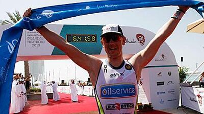 Frederil van Lierde crosses the finish line for the long course. Cristopher Pike / The National