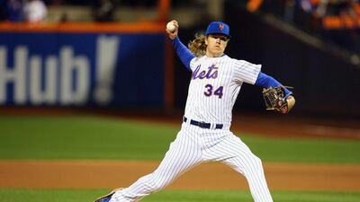 Noah Syndergaard of the New York Mets pitches in the first inning against the Kansas City Royals during Game 3. Mike Stobe / Getty Images