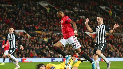 Marcus Rashford sees his shot saved by Partizan goalkeeper Vladimir Stojkovic. Getty