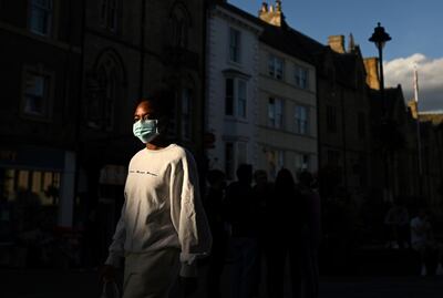 UK government advice switched to stress the importance of face masks in June. AFP