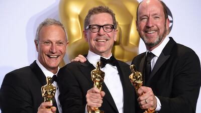 Chris Jenkins, right, Gregg Rudloff, centre, and Ben Osmo pose with their Oscar for Best Sound Mixing, Mad Max: Fury Road, in the press room during the 88th Oscars in Hollywood. Frederic J Brown / AFP photo