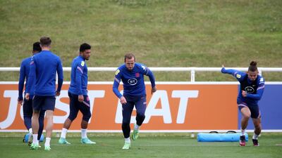England's Harry Kane, centre, and Kalvin Phillips, right. PA