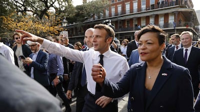 Ms Cantrell takes Mr Macron on a walking tour through the historic French Quarter. AFP