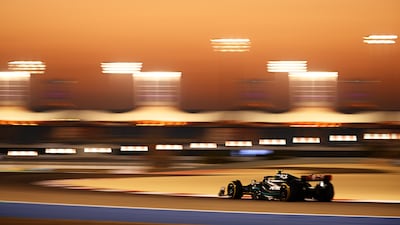 Lewis Hamilton of Great Britain drives his Mercedes under lights at Bahrain International Circuit. Getty
