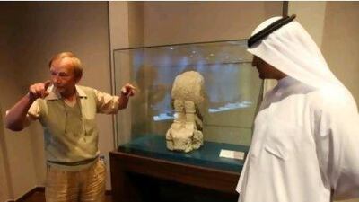 Dr Ernie Haerinck and Sheikh Khalid bin Humaid Al Mualla with a statue representing and an eagle cut in limestone. Pawan Singh / The National