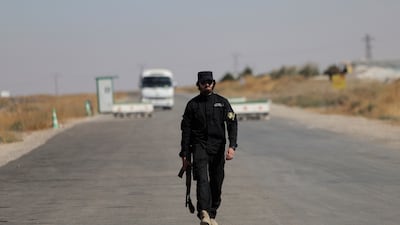 A Syrian security officer at a government checkpoint in the northern countryside of Sweida. Reuters