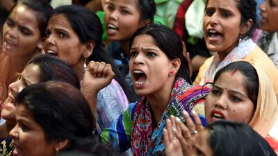 Indian women shout during a protest organised by Delhi Commission for Women in New Delhi, India, on April 13, 2018. Money Sharma / AFP