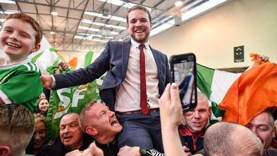 Sinn Fein's Donnchadh Ó Laoghaire (C) celebrates being the first TD elected to the 33rd Dáil, topping the poll ahead of Micheál Martin, Simon Coveney and Michael McGrath at Nemo Rangers GAA Club on February 9, 2020 in Cork, Ireland. Getty Images