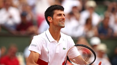Novak Djokovic celebrates after reaching the second round at the French Open. Clive Brunskill / Getty Images