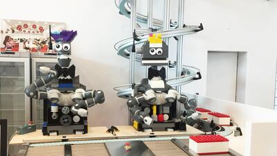 Lego robots on show. The plastic bricks are proving a smart investment. Lego House