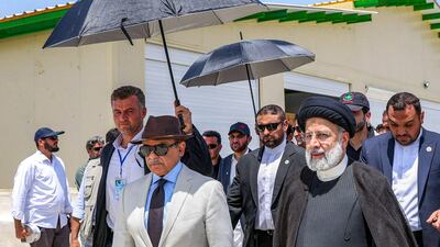 Iran's President Ebrahim Raisi, centre-right, and Pakistan's Prime Minister Shahbaz Sharif, centre-left, attending a ceremony to inaugurate a new border marketplace. AFP