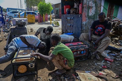 A generator is repaired at a workshop in the industrial area of Port Sudan, the seat of the military-backed government. AFP