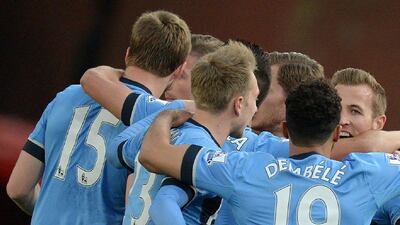 Harry Kane, right, celebrates with his Tottenham teammates after scoring his team’s first goal. Oli Scarff / AFP