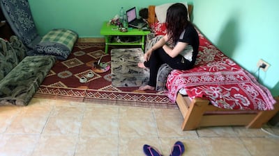 A Syrian sex trafficking victim sits in her safehouse at an undisclosed location in Lebanon on April 13, 2016, after she fled a brothel in Lebanon where she was being held captive. AFP Photo