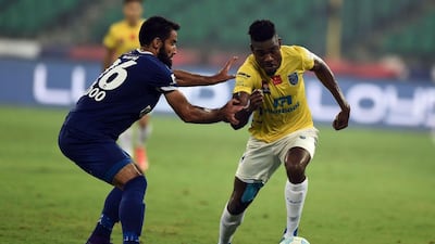 Chennaiyin defender Mehrajuddin Wadoo vies for the ball with Kerala Blasters forward Kervens Belfort during a match on Saturday. Arun Sankar / AFP / October 29, 2016