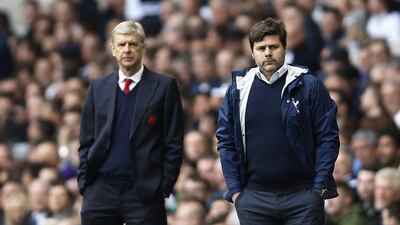 Arsene Wenger, the Arsenal manager, left, and Tottenham Hotspur manager Mauricio Pochettino look on during the North London derby at White Hart Lane on Sunday, April 30, 2017. Paul Childs / Reuters
