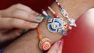 Rakhis also vary widely in design and price, from simple woven threads to intricate bejewelled ones. EPA