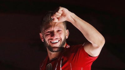 Adam Lallana celebrates at Anfield after Liverpool lifted the Premier League title following a 5-3 win over Chelsea. Reuters