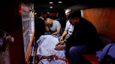 An ambulance carries the body of a Palestinian killed in violence near the village of Tell, in the occupied west Bank. Reuters