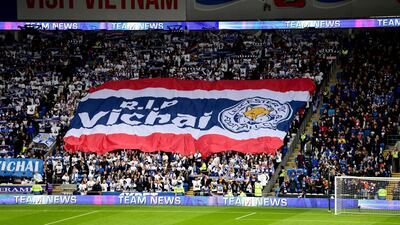 Leicester City fans with a giant banner that reads 'RIP Vichai' during the English Premier League soccer match between Cardiff City and Leicester City at the Cardiff City Stadium, Cardiff. Wales. AP