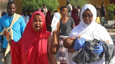 A woman weeps as her child was injured following a car bomb explosion in Mogadishu. Reuters